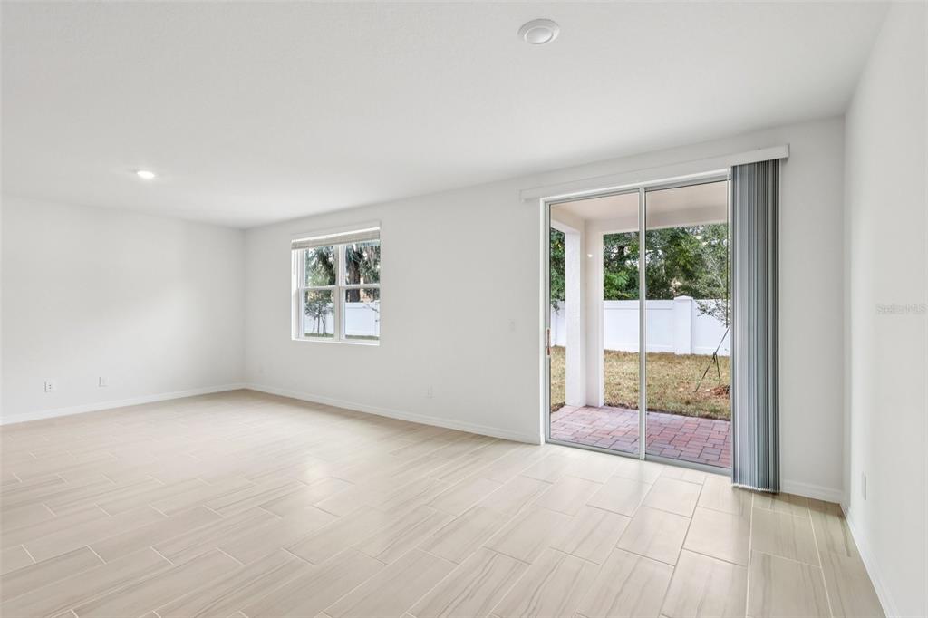 28009 Poppy Court Leesburg, FL 34748 - Photo 9 of 35 an empty room with windows