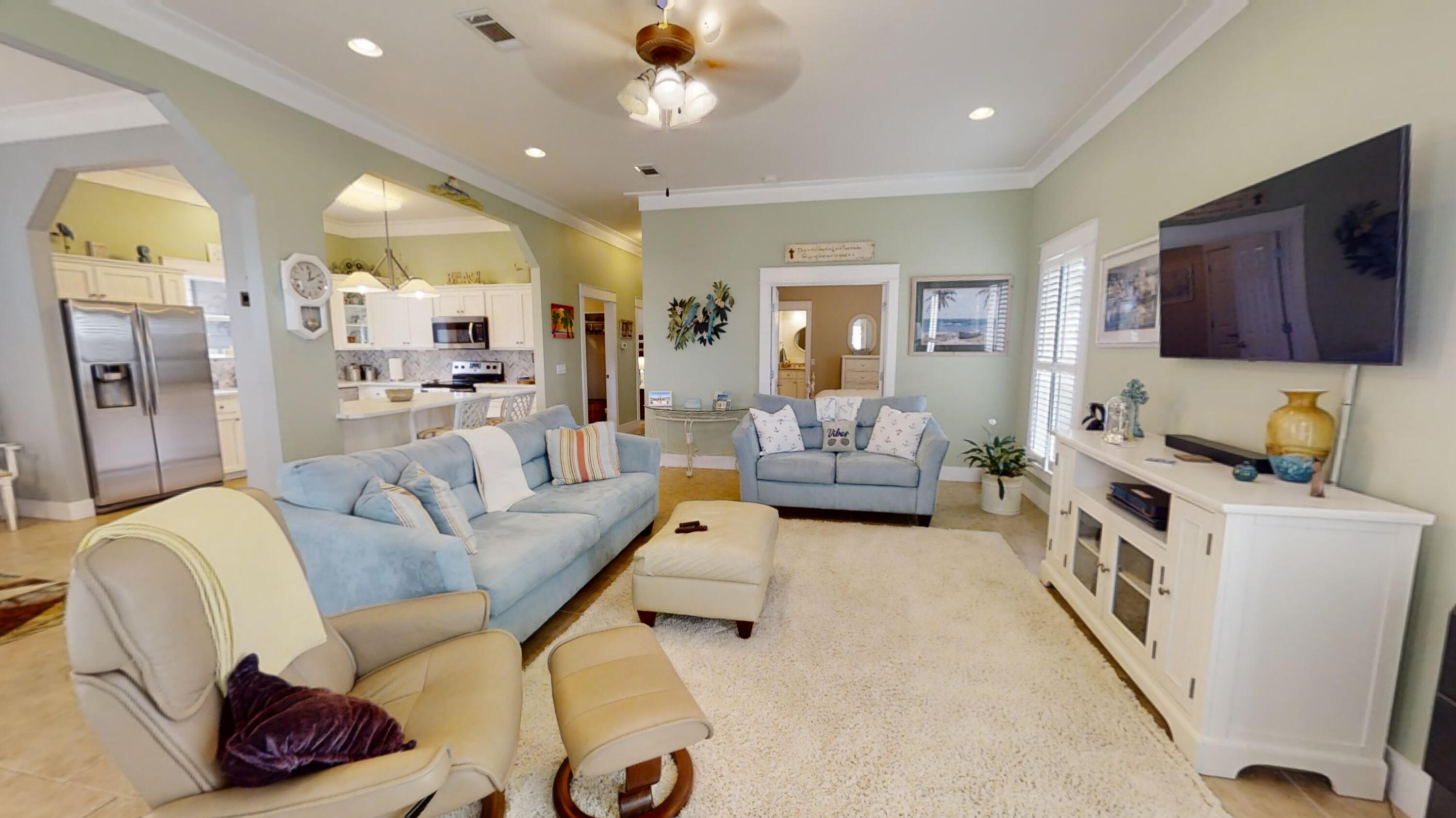192 Birch Street Santa Rosa Beach, FL 32459 - Photo 13 of 51 a living room with furniture and a flat screen tv