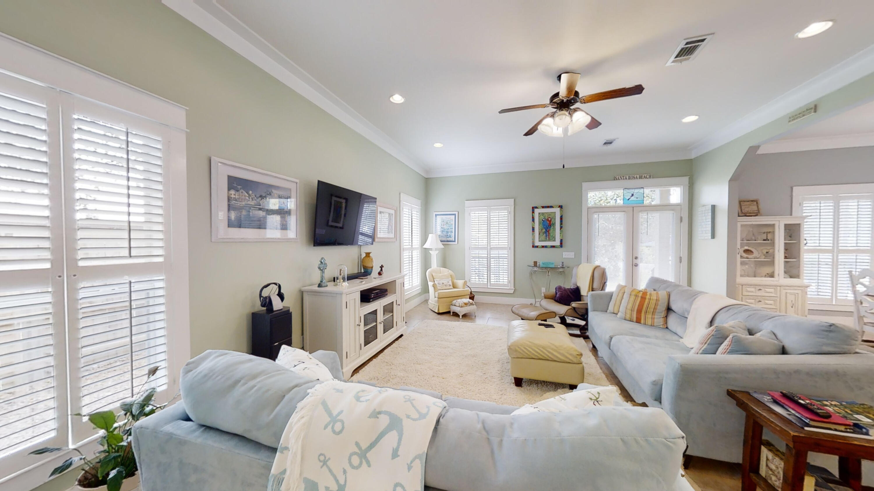 192 Birch Street Santa Rosa Beach, FL 32459 - Photo 17 of 51 a living room with furniture and a flat screen tv