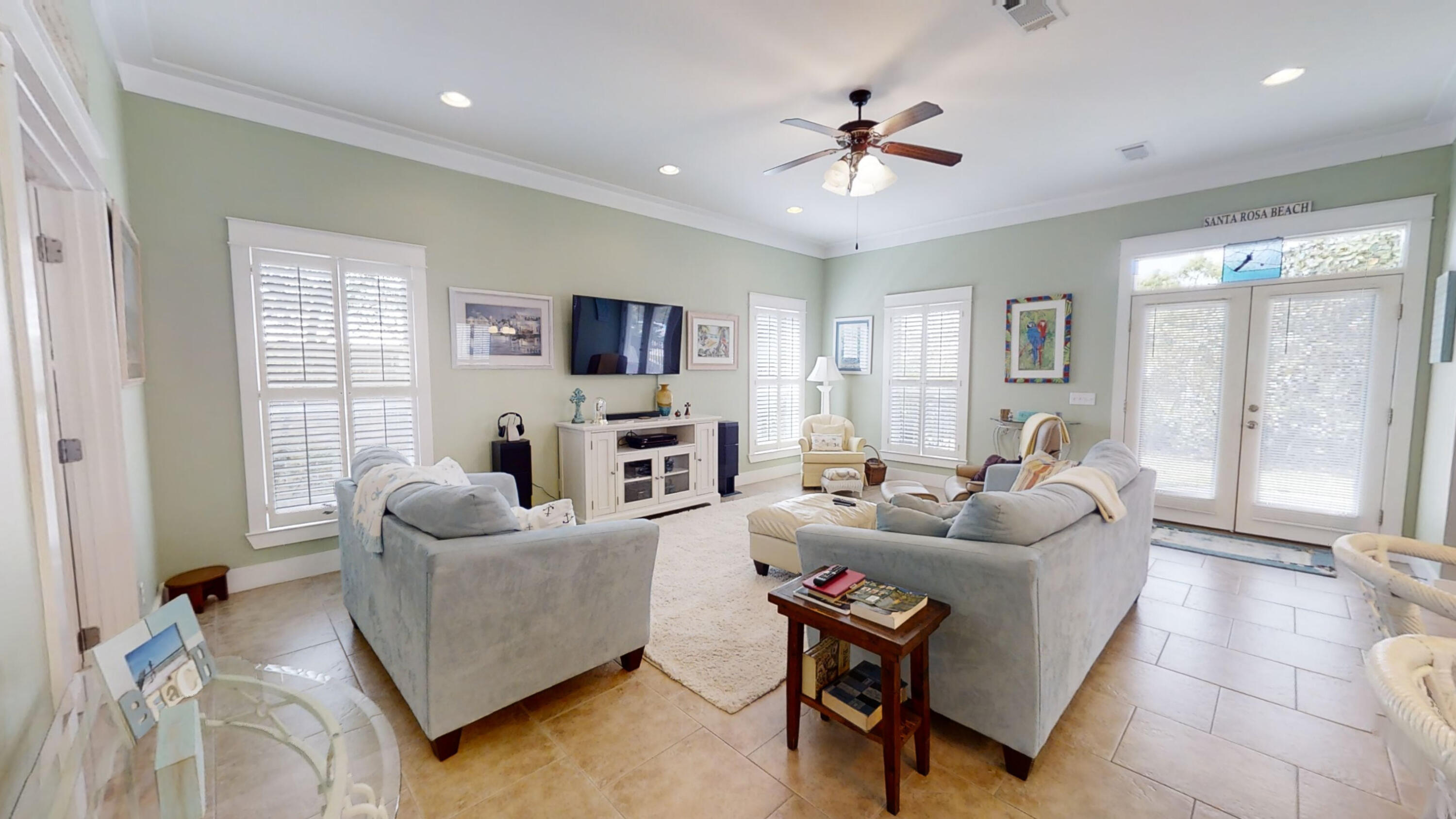 192 Birch Street Santa Rosa Beach, FL 32459 - Photo 18 of 51 a living room with furniture and a flat screen tv