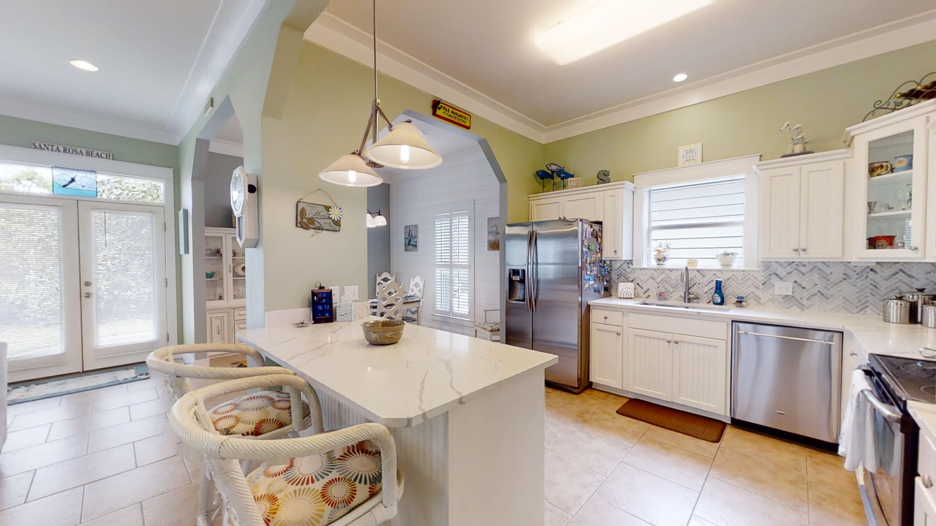 192 Birch Street Santa Rosa Beach, FL 32459 - Photo 19 of 51 a kitchen with granite countertop a sink a stove and cabinets