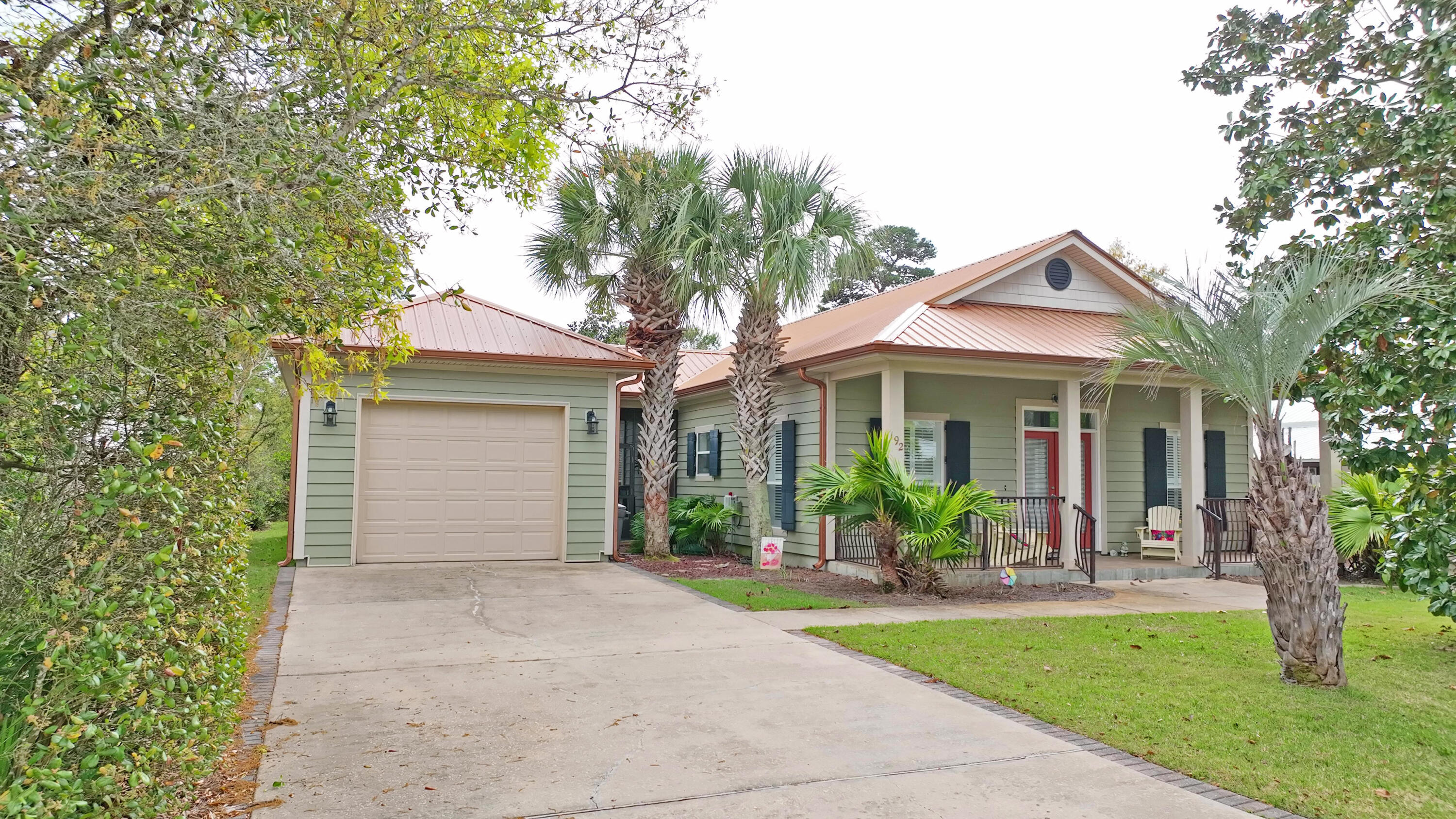 192 Birch Street Santa Rosa Beach, FL 32459 - Photo 2 of 51 a front view of a house with garden