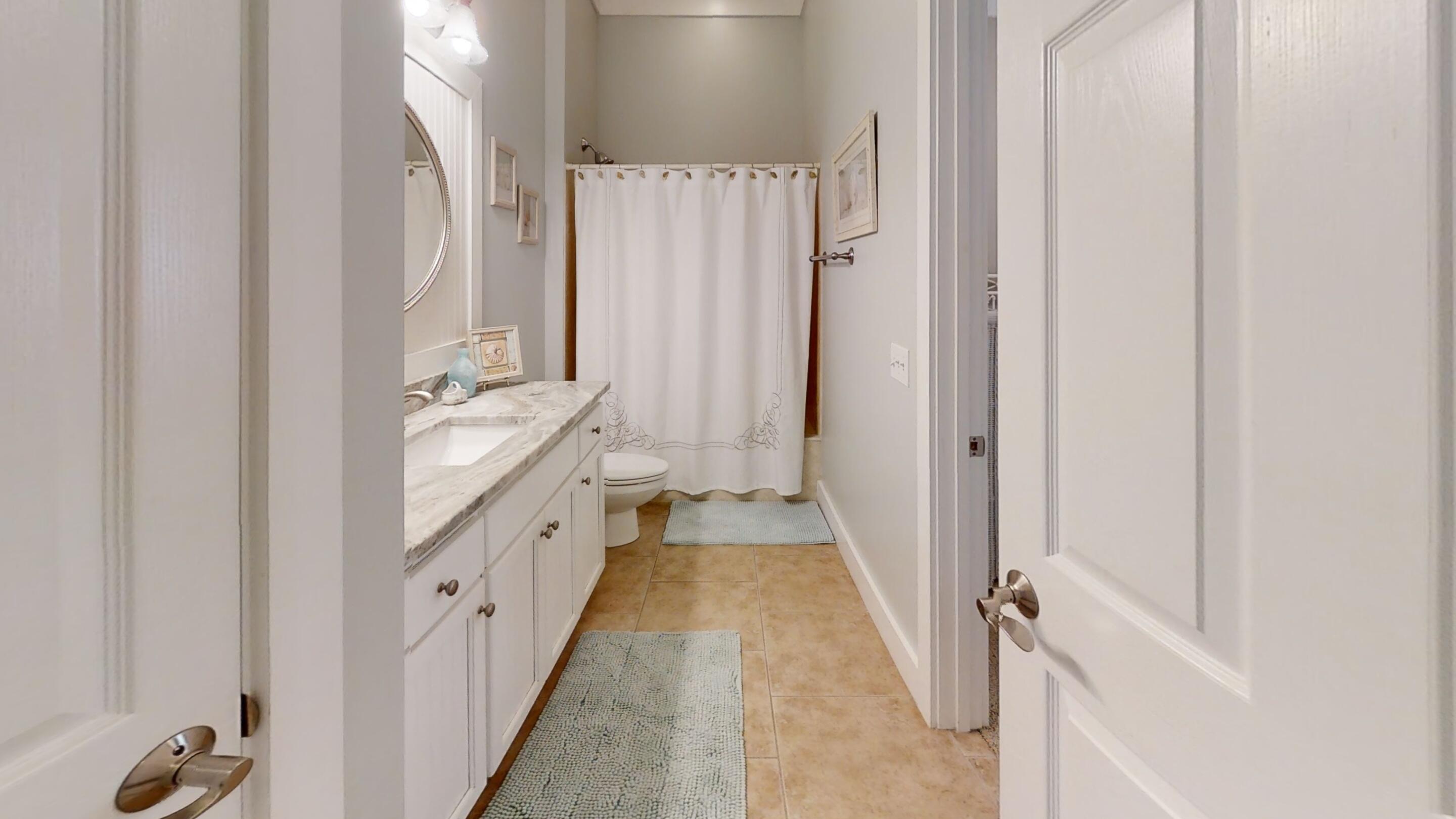 192 Birch Street Santa Rosa Beach, FL 32459 - Photo 27 of 51 a spacious en suite bathroom with a double vanity sink and a mirror