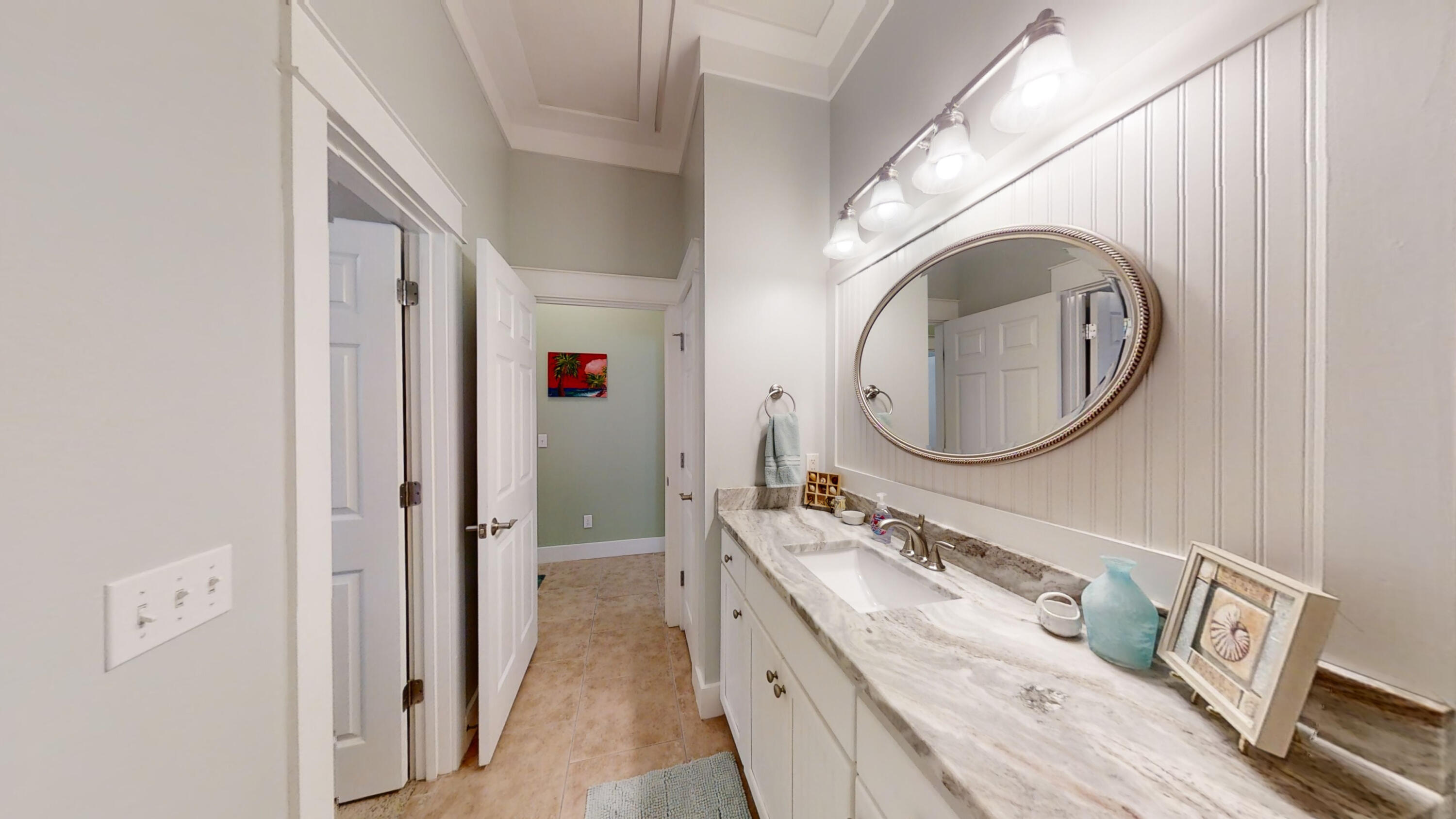 192 Birch Street Santa Rosa Beach, FL 32459 - Photo 29 of 51 a bathroom with a granite countertop double vanity sink and a mirror