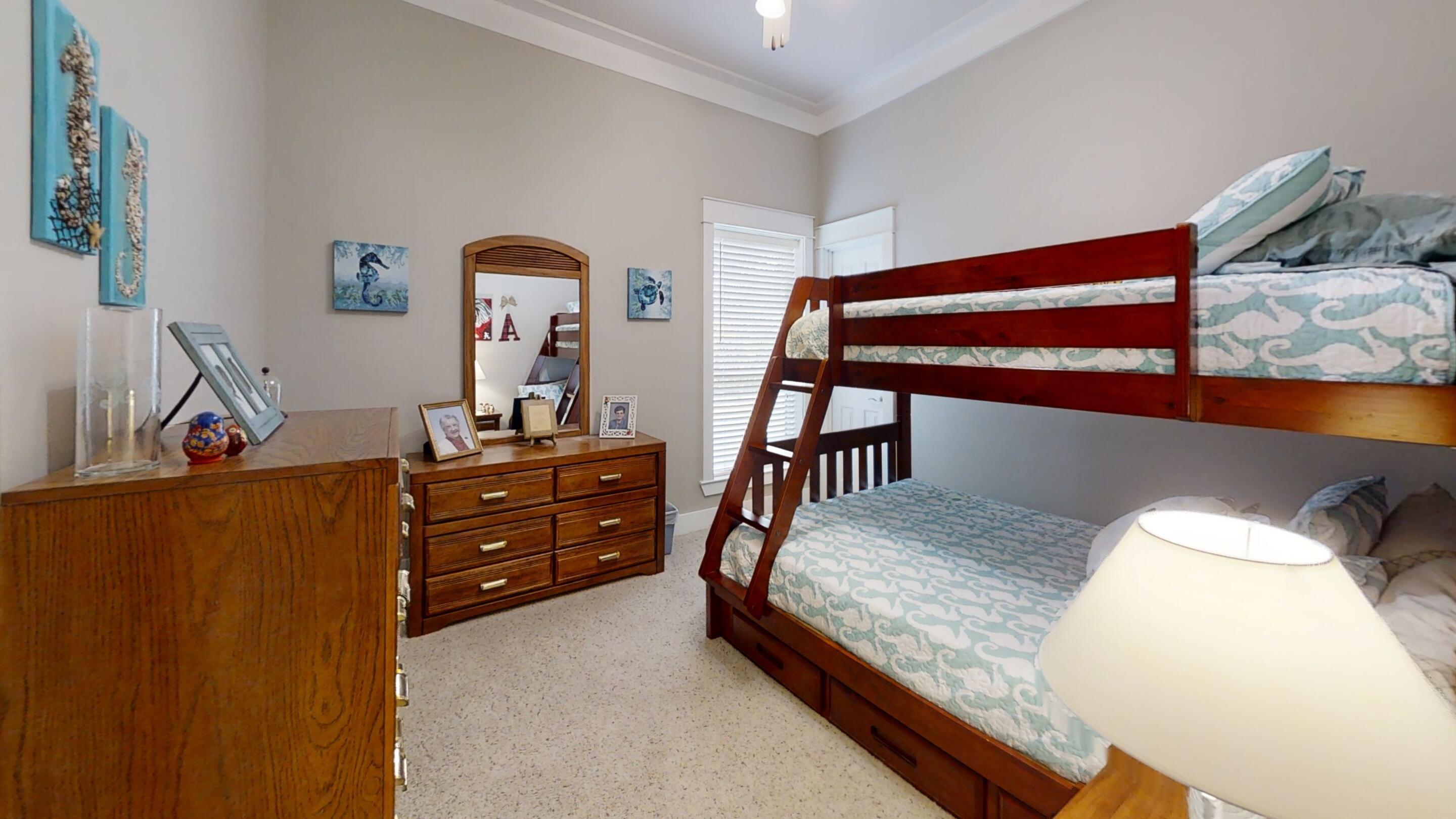 192 Birch Street Santa Rosa Beach, FL 32459 - Photo 30 of 51 a bedroom with a bed and a dresser