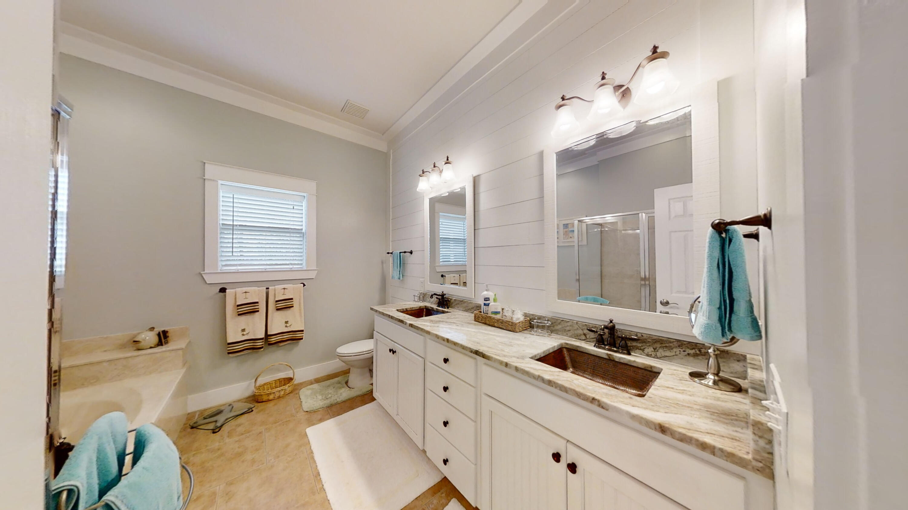 192 Birch Street Santa Rosa Beach, FL 32459 - Photo 40 of 51 a spacious bathroom with a double vanity sink mirror and bathtub