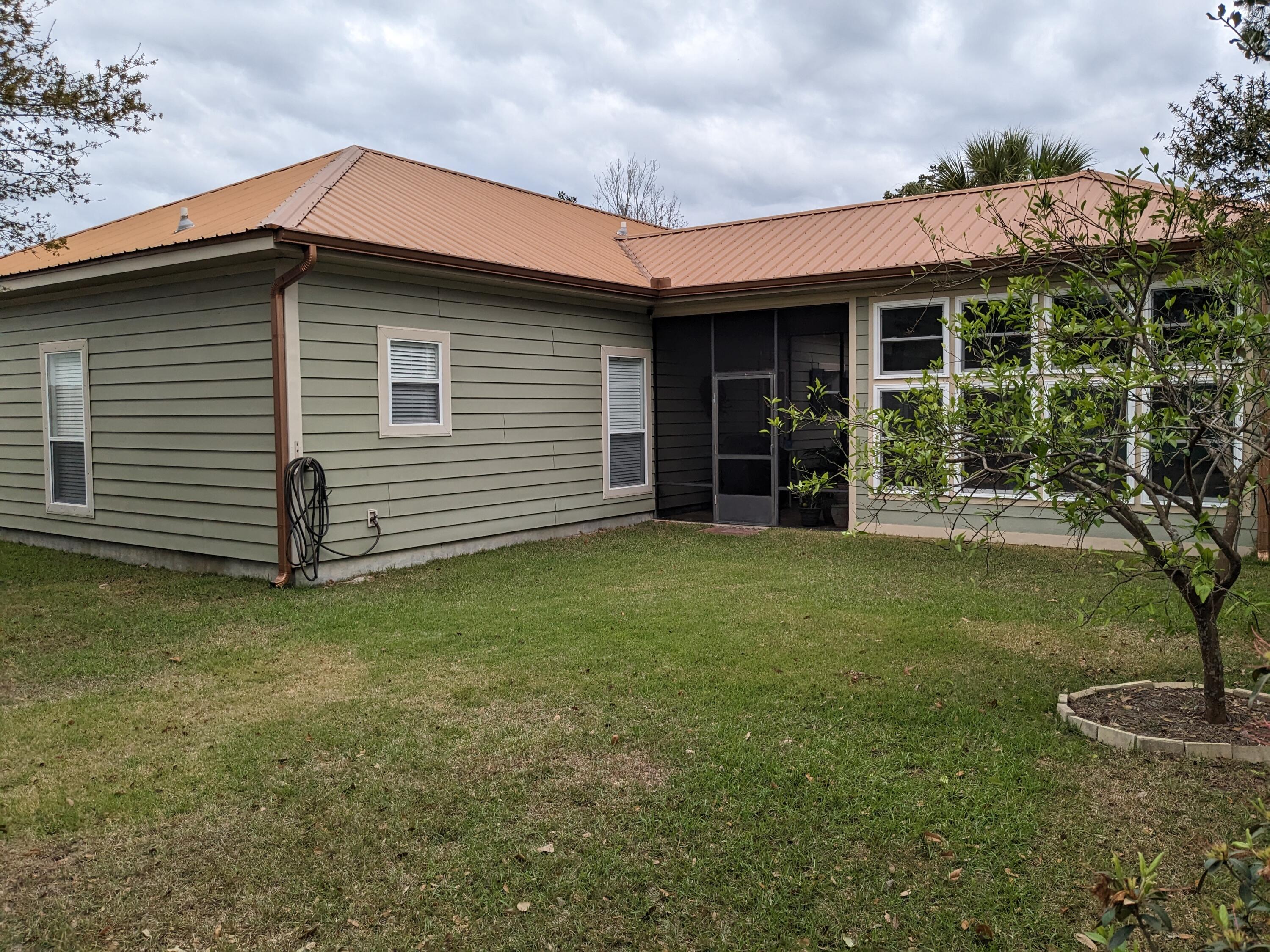 192 Birch Street Santa Rosa Beach, FL 32459 - Photo 45 of 51 a view of a house with a garden