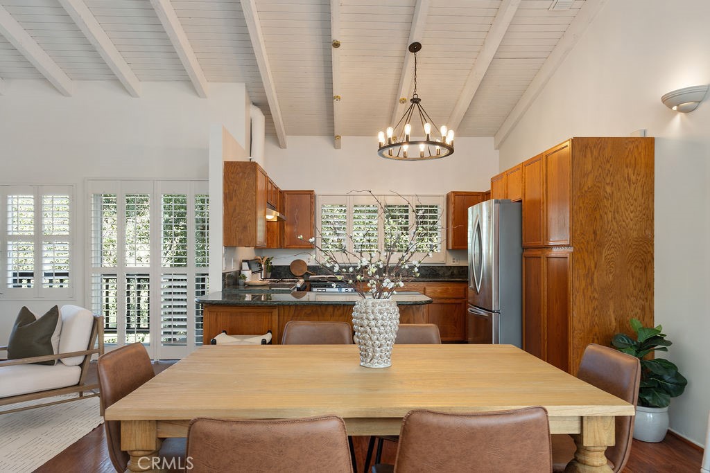 235 Spinks Canyon Road Duarte, CA 91010 - Photo 9 of 62 a view of a dining room with furniture a chandelier and large windows