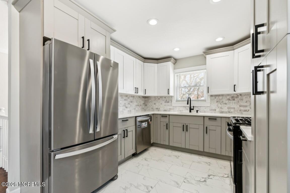 96 Twin Rivers Drive Toms River, NJ 08753 - Photo 11 of 37 a kitchen with stainless steel appliances granite countertop a refrigerator and a sink