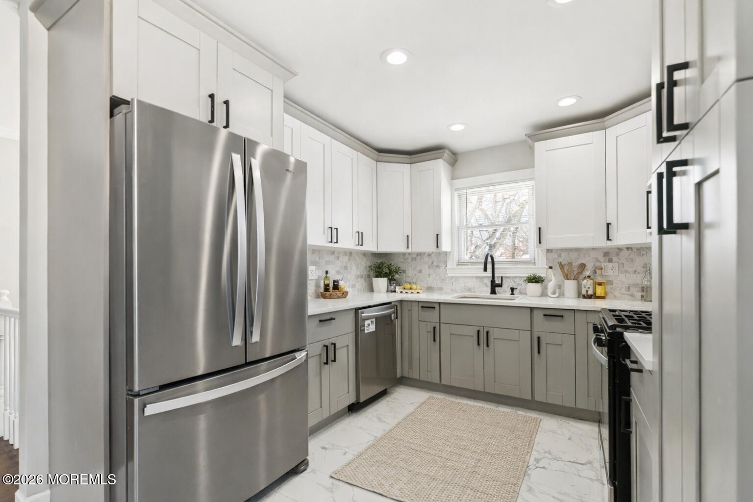 96 Twin Rivers Drive Toms River, NJ 08753 - Photo 12 of 37 a kitchen with stainless steel appliances a refrigerator sink and cabinets