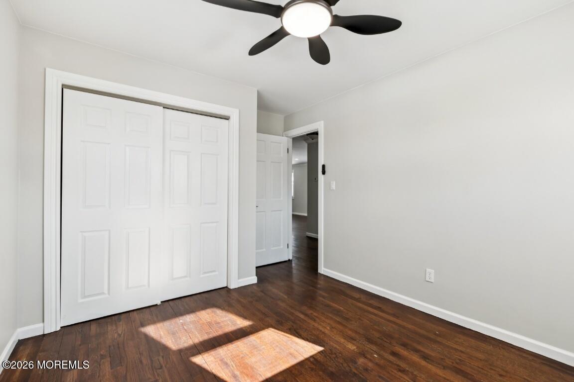 96 Twin Rivers Drive Toms River, NJ 08753 - Photo 21 of 37 an empty room with wooden floor closet and windows