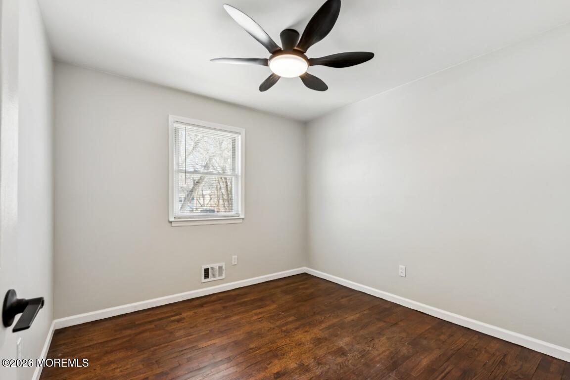 96 Twin Rivers Drive Toms River, NJ 08753 - Photo 22 of 37 an empty room with a window and a fan
