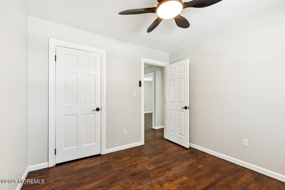 96 Twin Rivers Drive Toms River, NJ 08753 - Photo 24 of 37 a view of an empty room with wooden floor