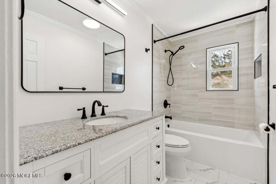 96 Twin Rivers Drive Toms River, NJ 08753 - Photo 25 of 37 a bathroom with a granite countertop sink a toilet and shower