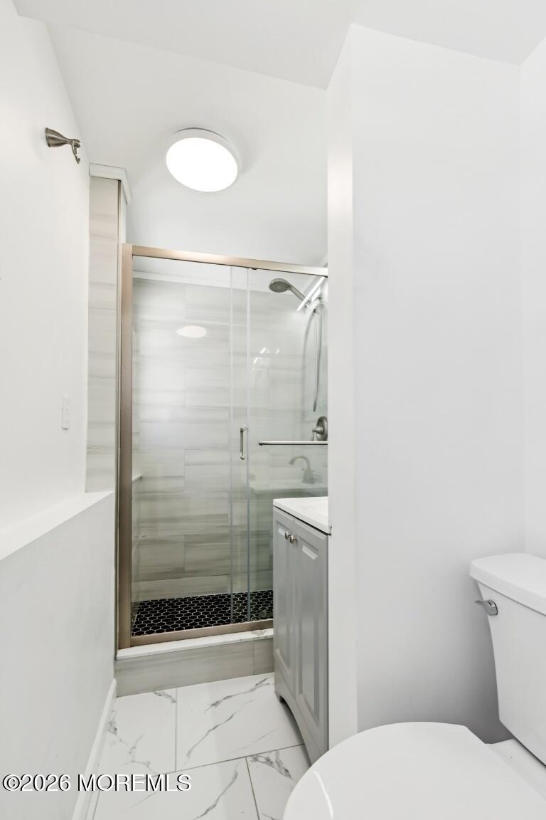 96 Twin Rivers Drive Toms River, NJ 08753 - Photo 34 of 37 a bathroom with a shower and a toilet