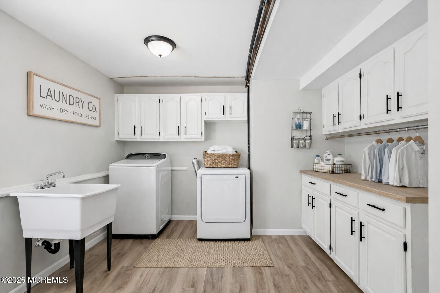 96 Twin Rivers Drive Toms River, NJ 08753 - Photo 37 of 37 a utility room with cabinets washer and dryer