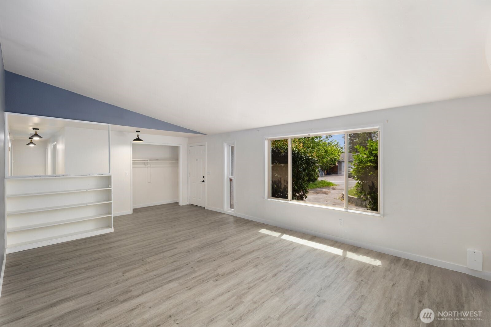 101 161st Street Southeast Bothell, WA 98012 - Photo 11 of 34 wooden floor in an empty room with a window