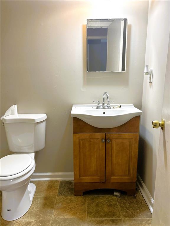 2115 Venesa Circle Austell, GA 30168 - Photo 4 of 28 a bathroom with a sink a toilet and mirror