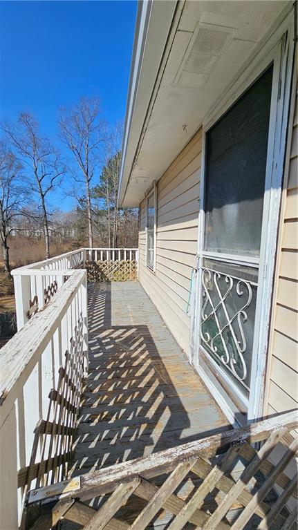 2115 Venesa Circle Austell, GA 30168 - Photo 6 of 28 a view of a balcony with wooden floor and fence