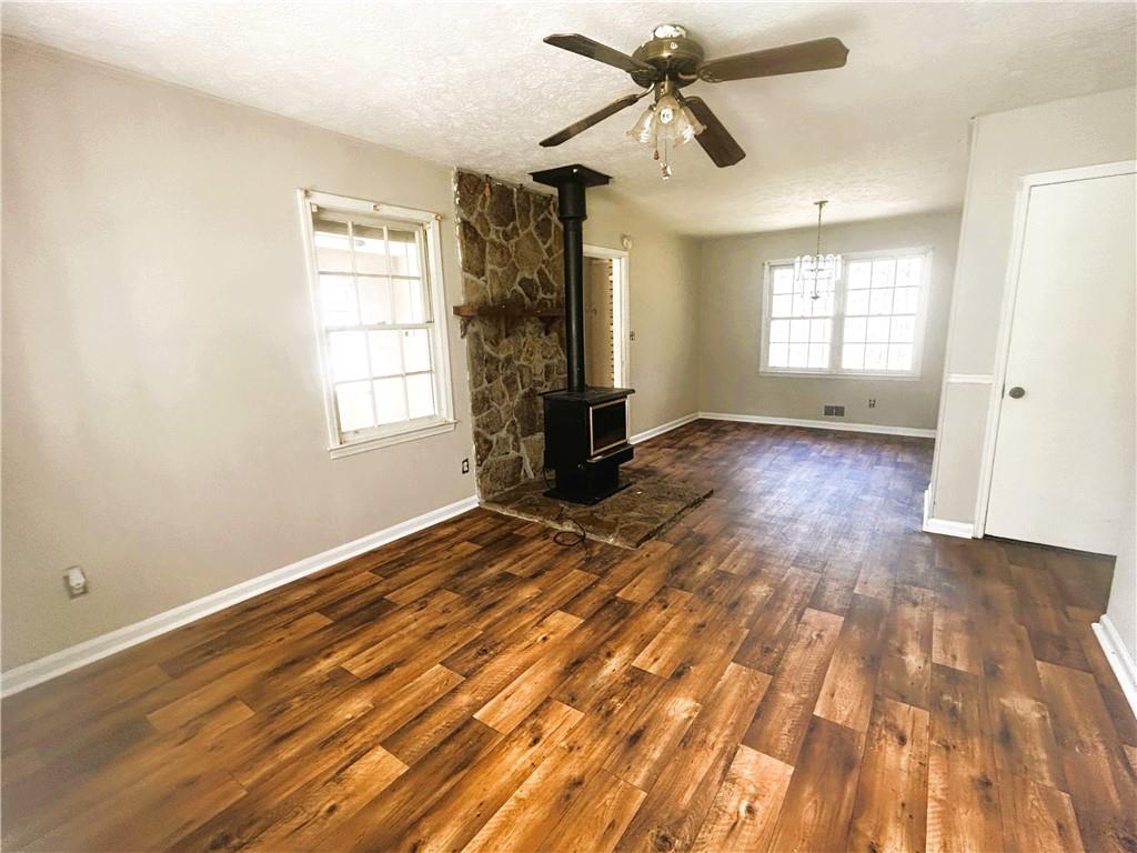 2115 Venesa Circle Austell, GA 30168 - Photo 7 of 28 a view of an empty room with wooden floor and a window