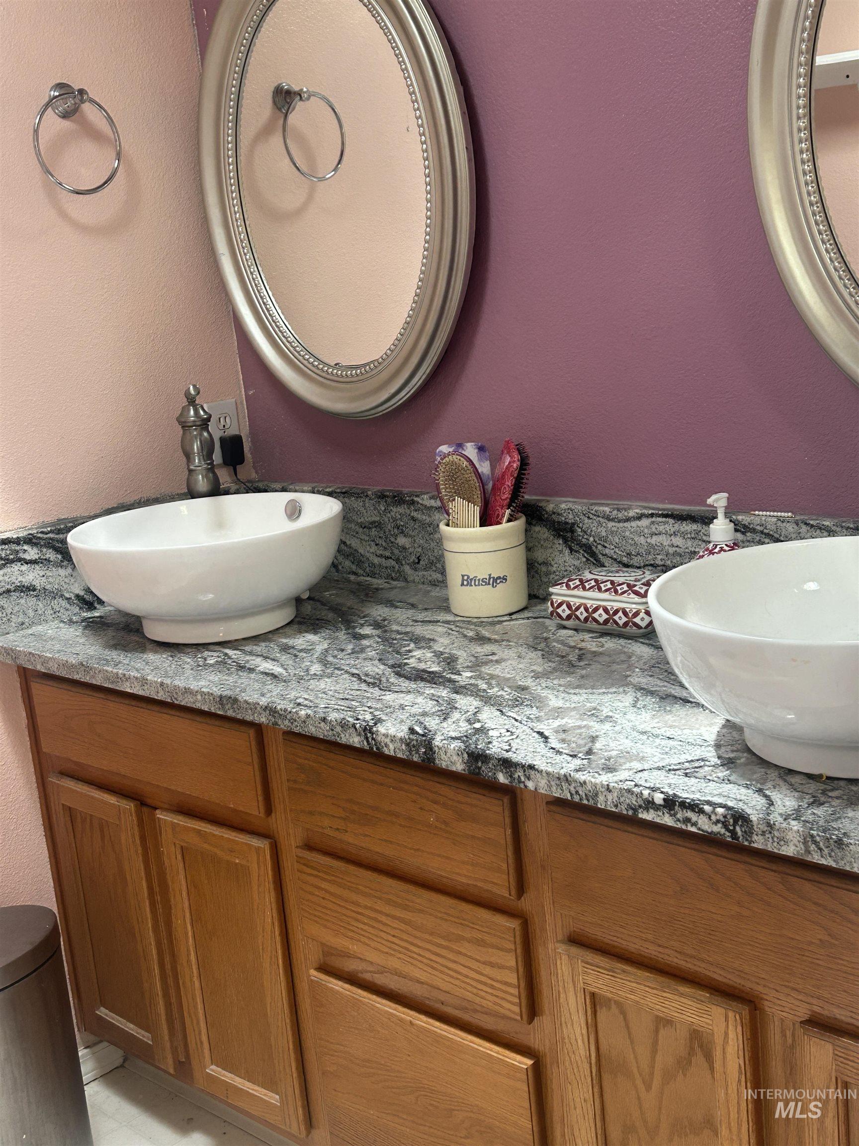 1444 East Doberman Street Meridian, ID 83642 - Photo 27 of 31 Double vanity featuring vessel sinks and a patterned countertop