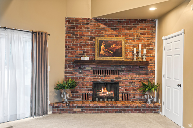 460 Omni Point Road Central Valley, UT 84754 - Photo 37 of 101 Brick fireplace with a wood mantel and hearth