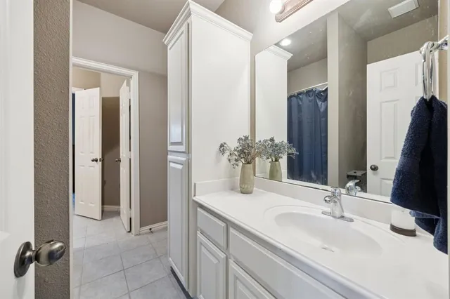 a balcony with furniture and a potted plant