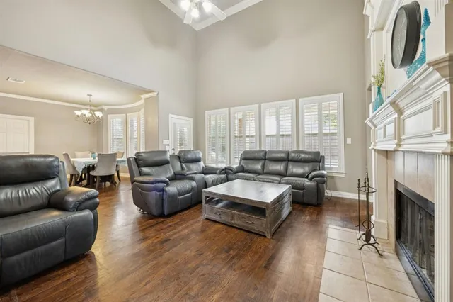 a bathroom with a bathtub a window a shower and a sink