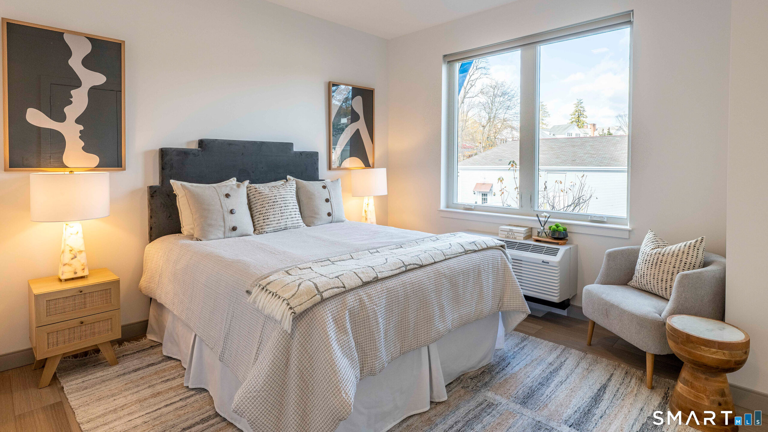 22 Hubbard Road Wilton, CT 06897 - Photo 14 of 19 a bedroom with a bed and a couch