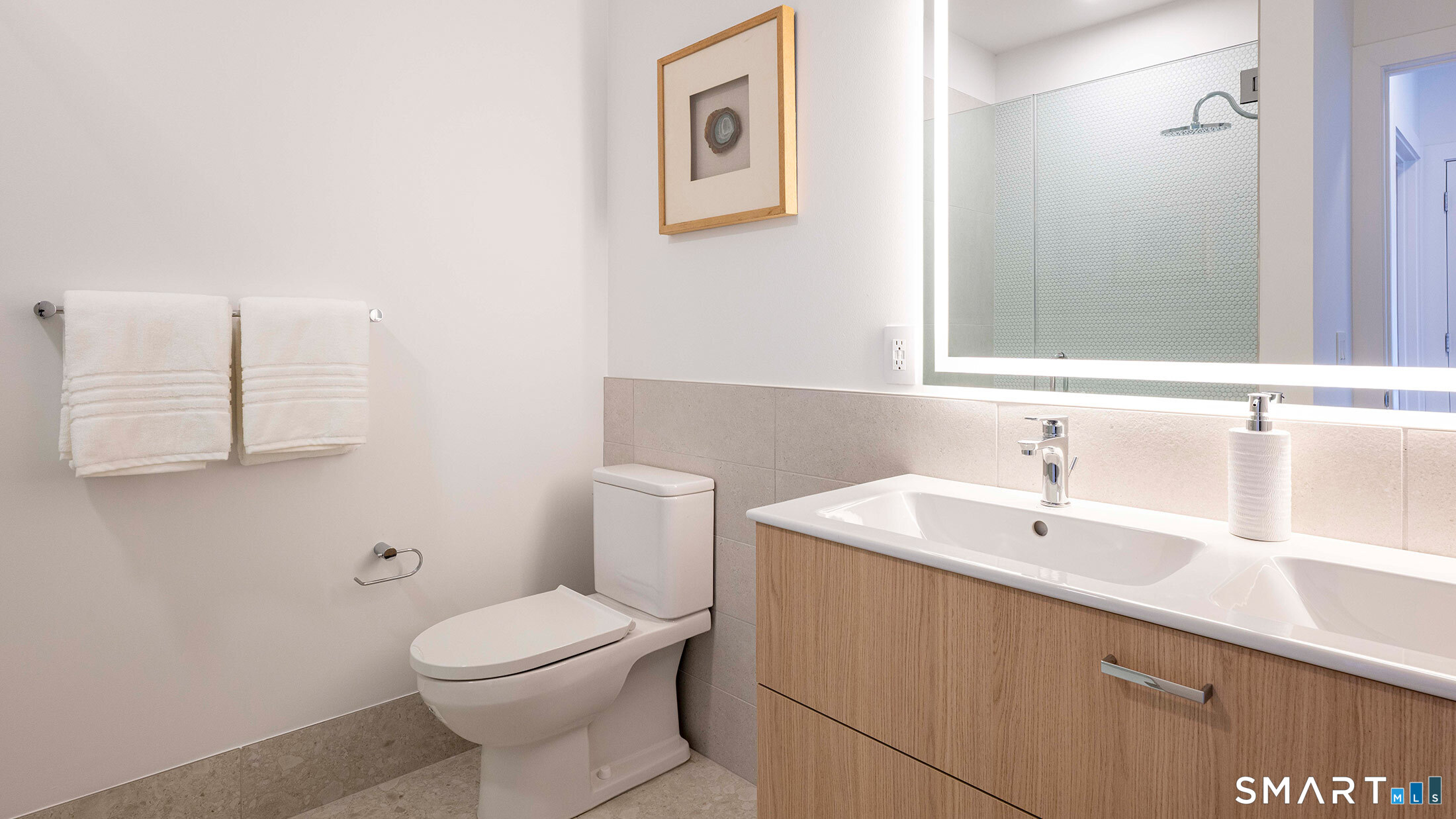 22 Hubbard Road Wilton, CT 06897 - Photo 17 of 19 a bathroom with a toilet sink and mirror