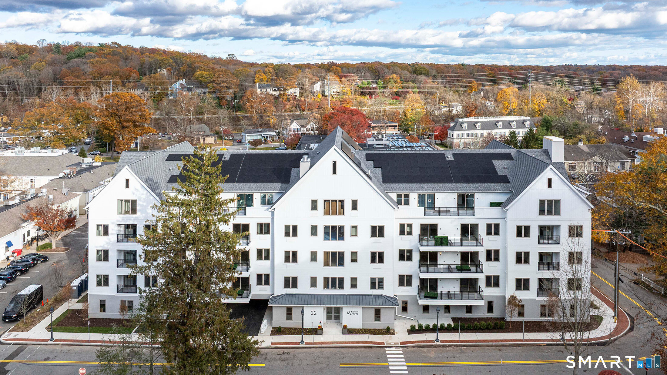 22 Hubbard Road Wilton, CT 06897 - Photo 2 of 19 a view of a large building with a clock on the wall