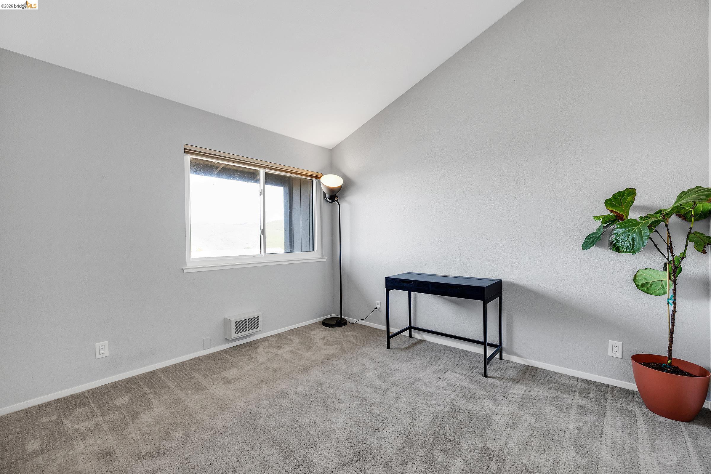 407 Vista Heights Road El Cerrito, CA 94530 - Photo 19 of 29 Unfurnished room with lofted ceiling and light colored carpet