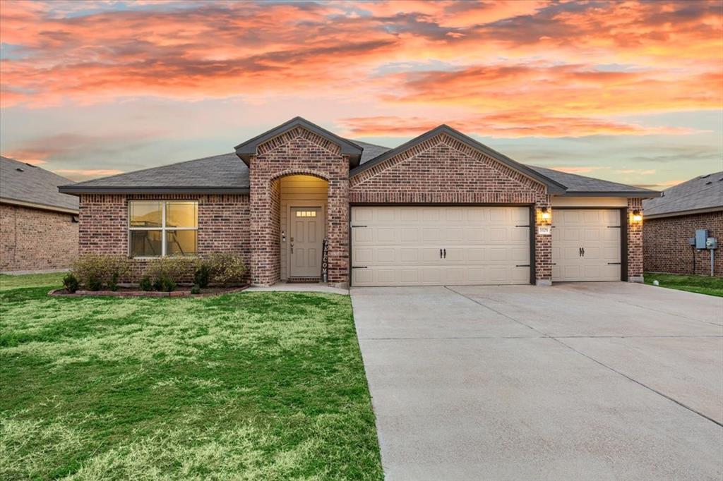 3105 Beutel Road Lorena, TX 76655 - Photo 1 of 26 a front view of a house with a yard and garage