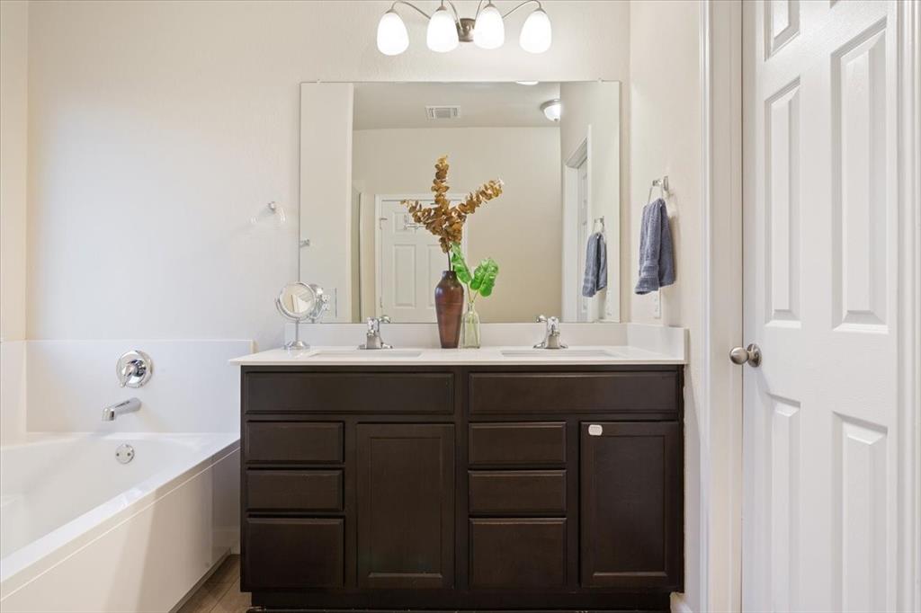 3105 Beutel Road Lorena, TX 76655 - Photo 15 of 26 a bathroom with a sink and a mirror