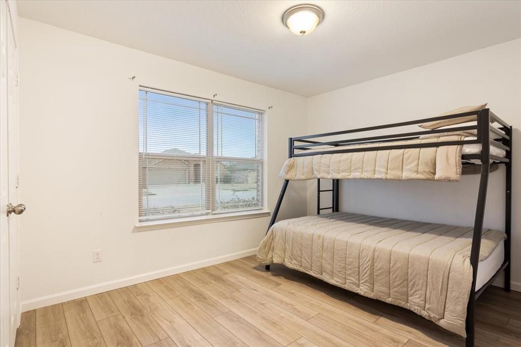 3105 Beutel Road Lorena, TX 76655 - Photo 20 of 26 a bedroom with a bed and a window