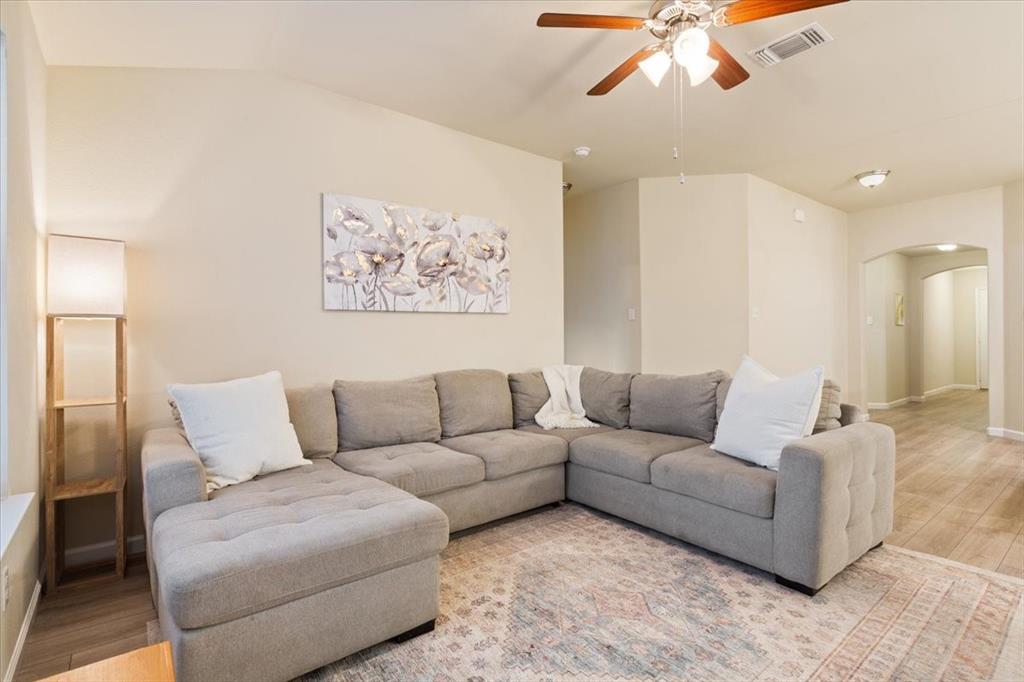 3105 Beutel Road Lorena, TX 76655 - Photo 4 of 26 a living room with furniture and a large mirror