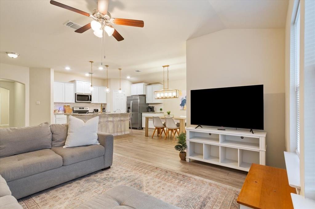 3105 Beutel Road Lorena, TX 76655 - Photo 7 of 26 a living room with furniture and a flat screen tv