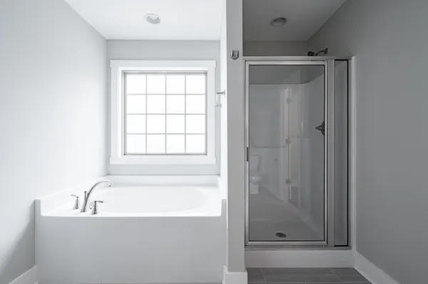 a white bath tub sitting next to a window
