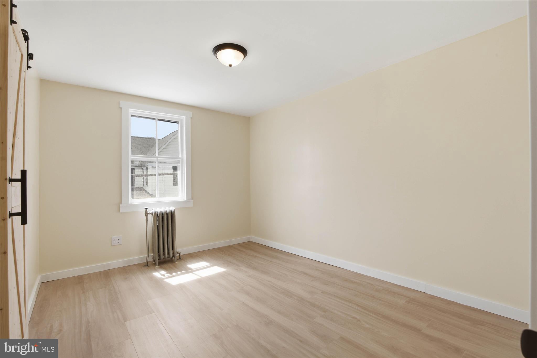 101 East Lincoln Avenue Lititz, PA 17543 - Photo 23 of 39 an empty room with wooden floor and windows