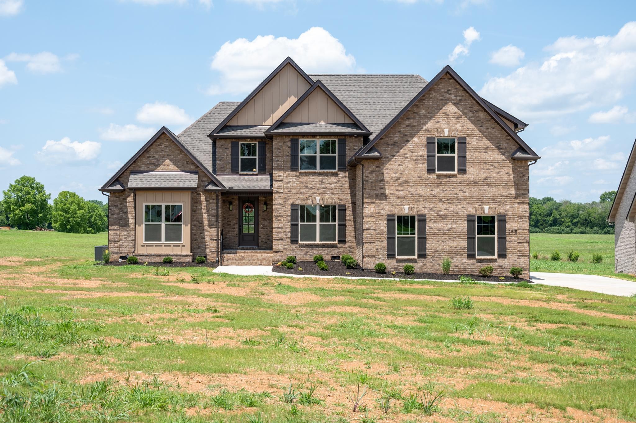 2416 Dilton Mankin Road Murfreesboro, TN 37127 - Photo 1 of 36 a front view of a house with a yard
