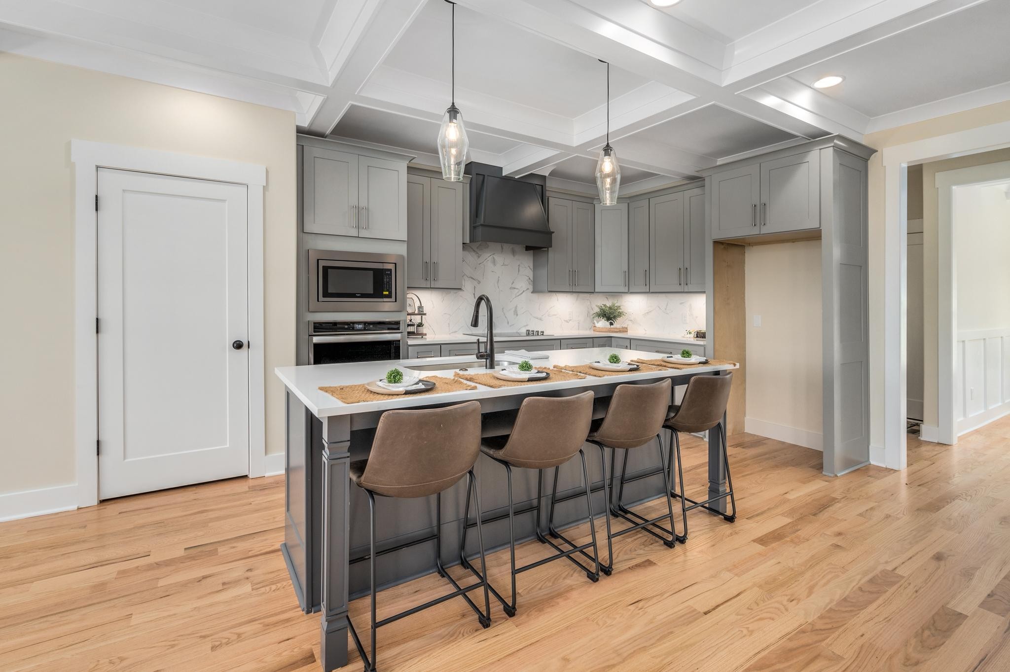 2416 Dilton Mankin Road Murfreesboro, TN 37127 - Photo 11 of 36 a kitchen with stainless steel appliances a table chairs refrigerator and microwave
