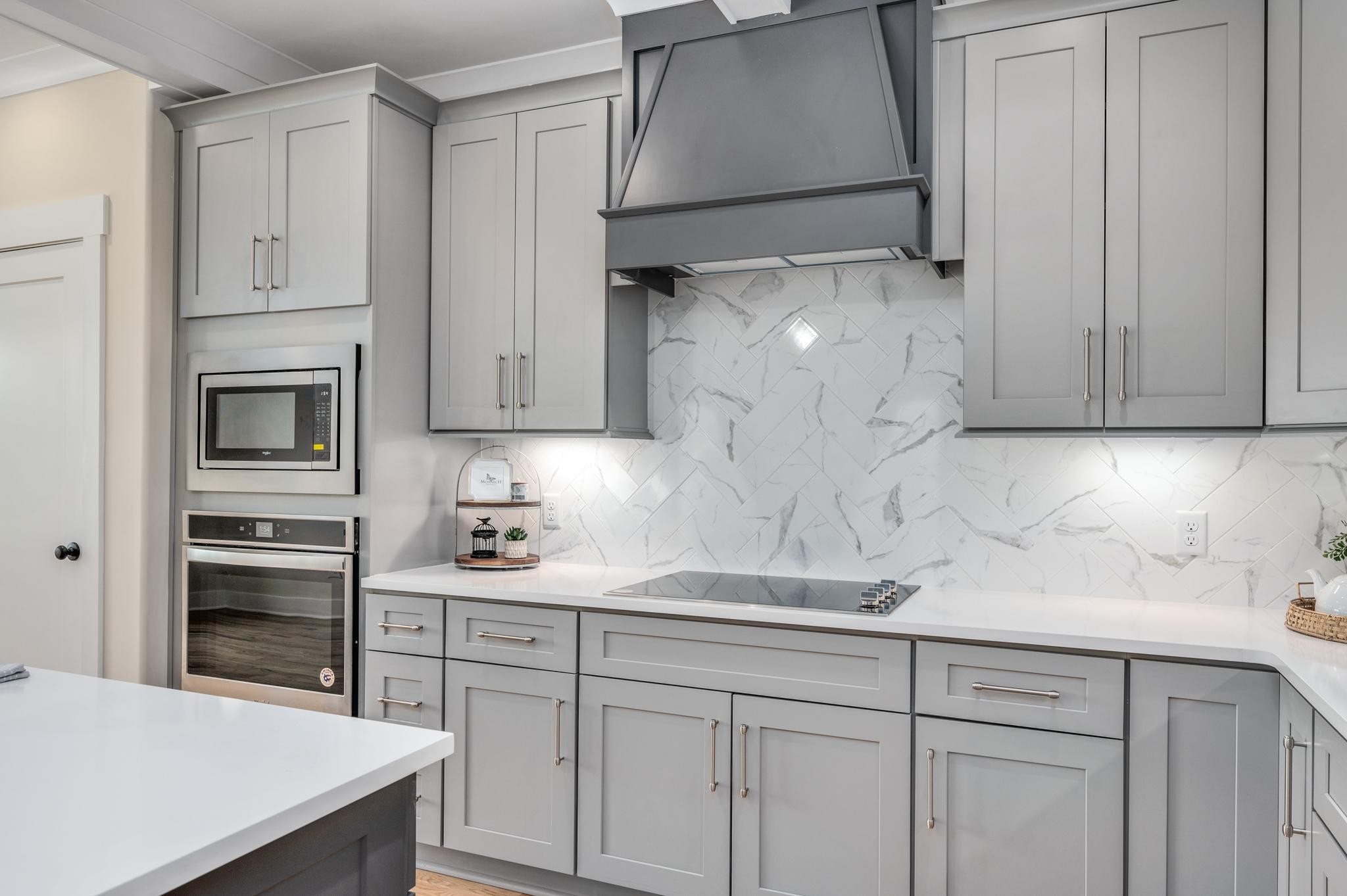 2416 Dilton Mankin Road Murfreesboro, TN 37127 - Photo 13 of 36 a kitchen with white cabinets and white appliances
