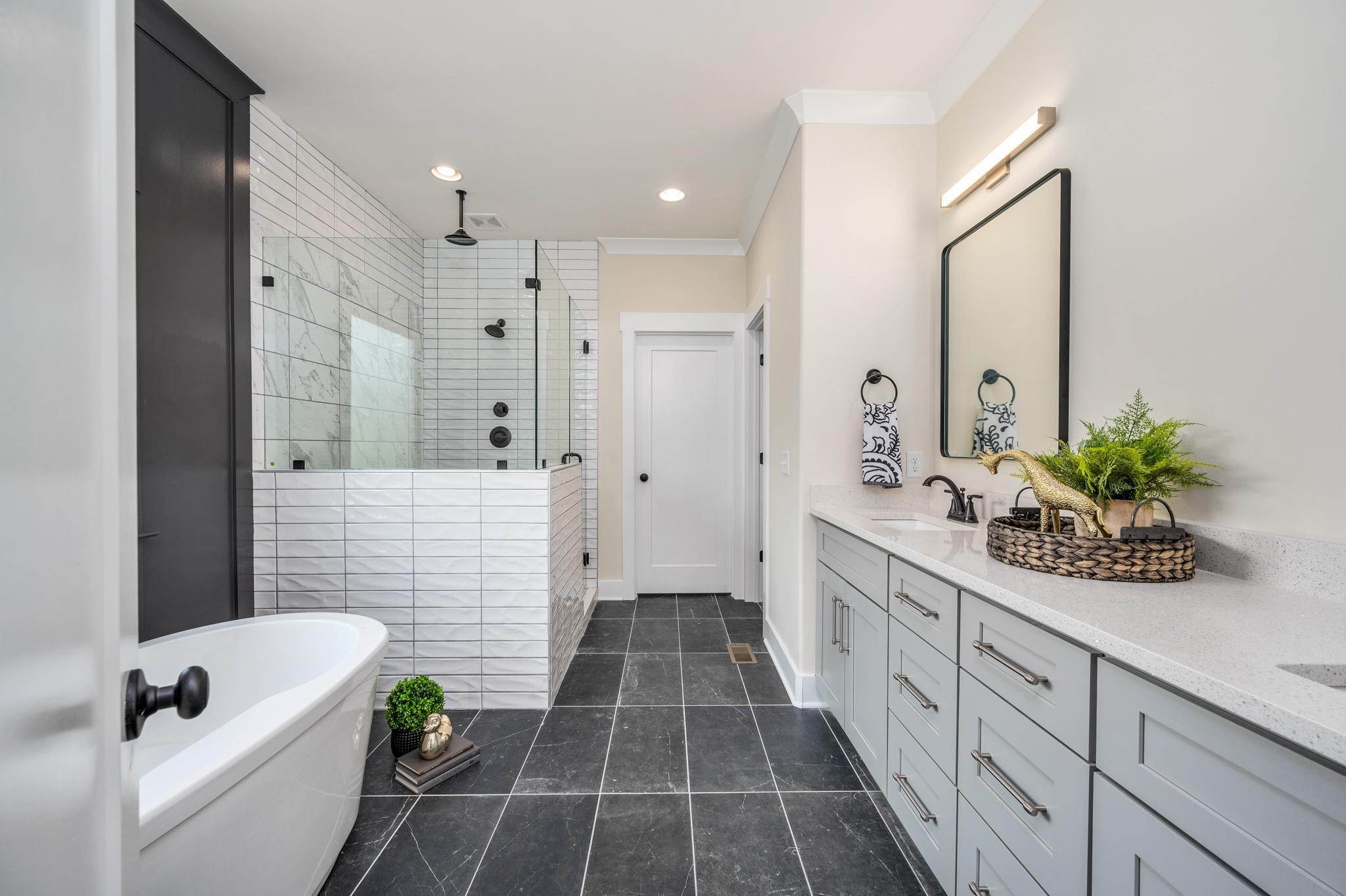 2416 Dilton Mankin Road Murfreesboro, TN 37127 - Photo 17 of 36 a spacious bathroom with a granite countertop tub a double vanity sink and a shower