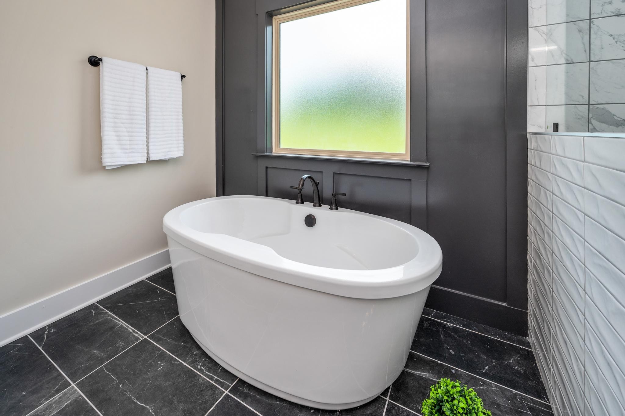 2416 Dilton Mankin Road Murfreesboro, TN 37127 - Photo 18 of 36 a white bath tub sitting next to a white sink