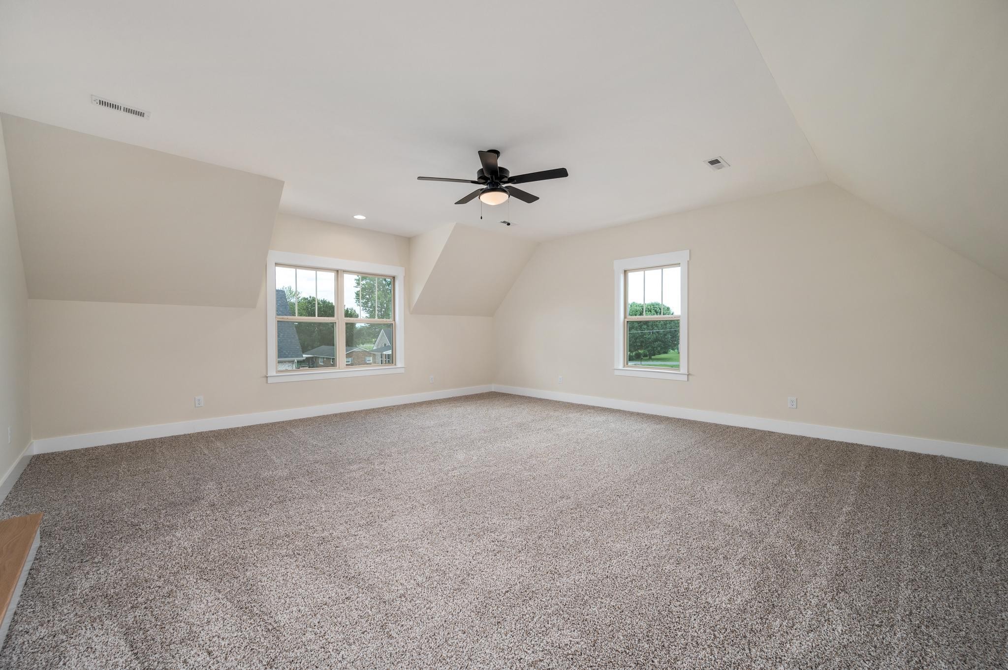 2416 Dilton Mankin Road Murfreesboro, TN 37127 - Photo 31 of 36 an empty room with windows and ceiling fan