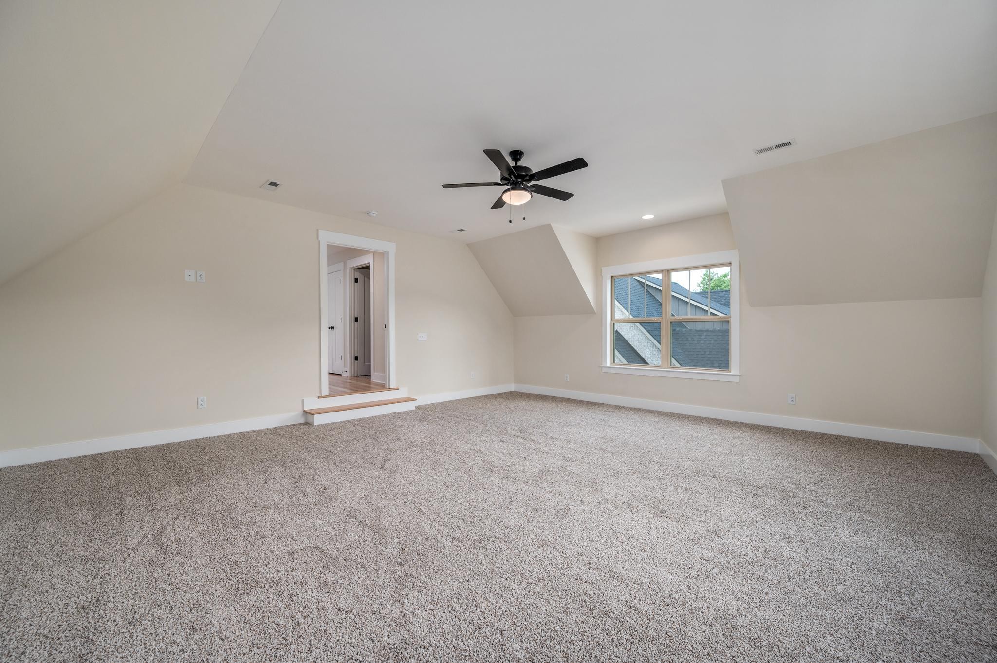 2416 Dilton Mankin Road Murfreesboro, TN 37127 - Photo 32 of 36 an empty room with windows and ceiling fan