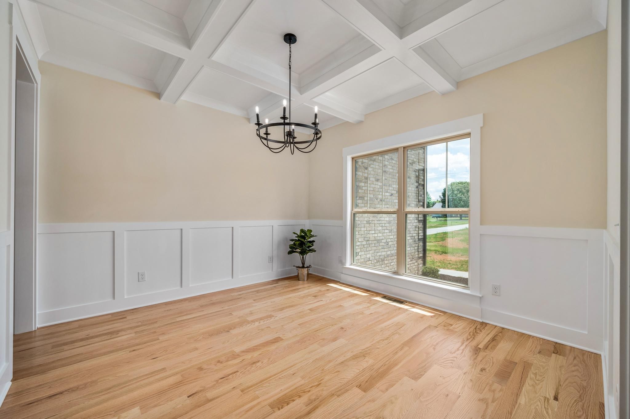 2416 Dilton Mankin Road Murfreesboro, TN 37127 - Photo 5 of 36 a view of an empty room with a window and wooden floor