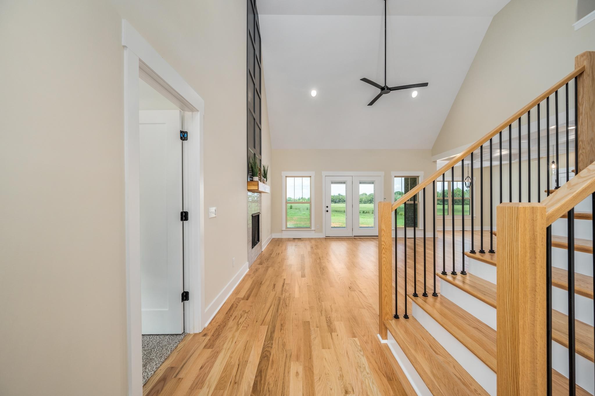 2416 Dilton Mankin Road Murfreesboro, TN 37127 - Photo 7 of 36 a view of a hallway with wooden floor and staircase