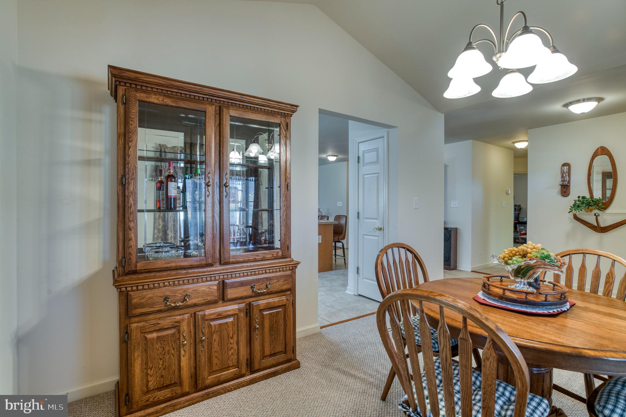 421 Queen Street Culpeper, VA 22701 - Photo 22 of 52 a view of a dining room with furniture and chandelier