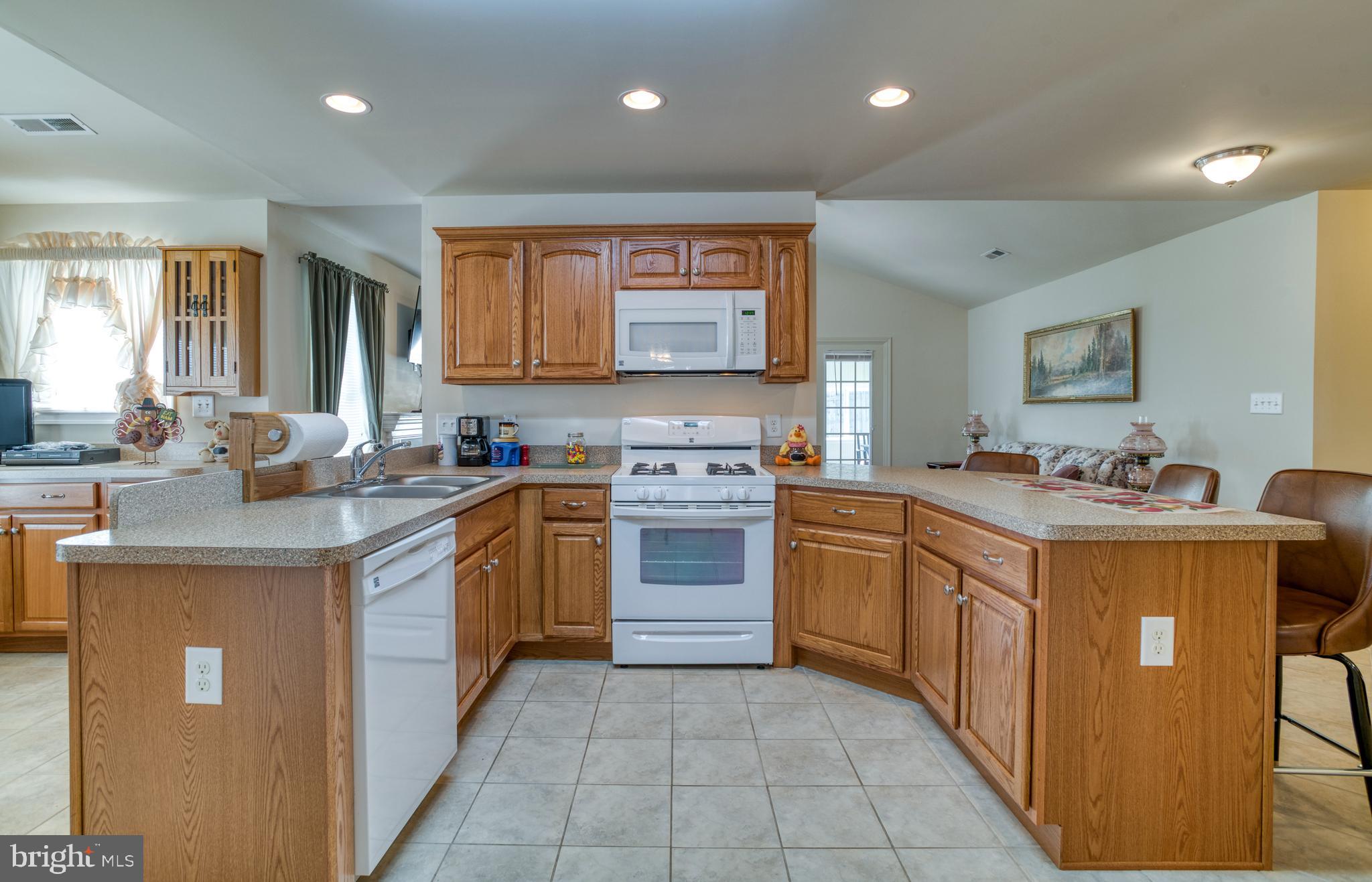 421 Queen Street Culpeper, VA 22701 - Photo 23 of 52 a kitchen with a stove top oven sink and cabinets